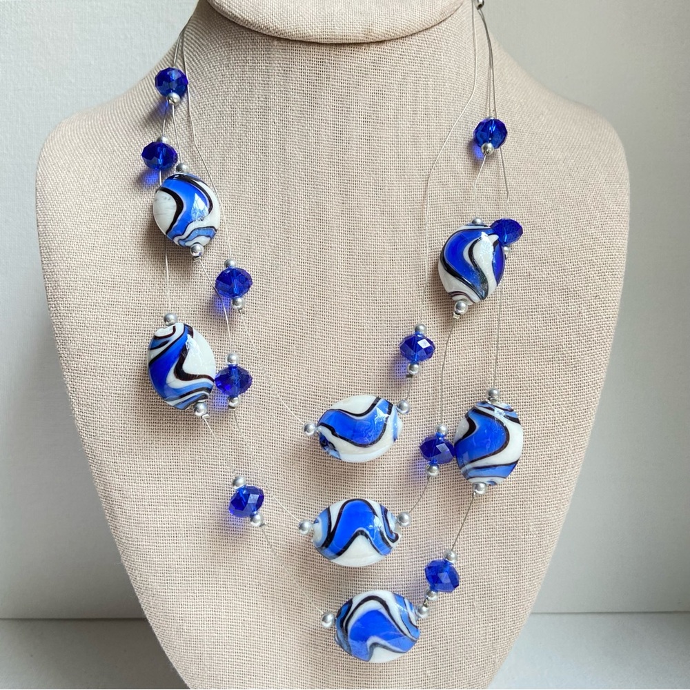 Art glass and blue crystal floating bead necklace on multistrand silvertone wire